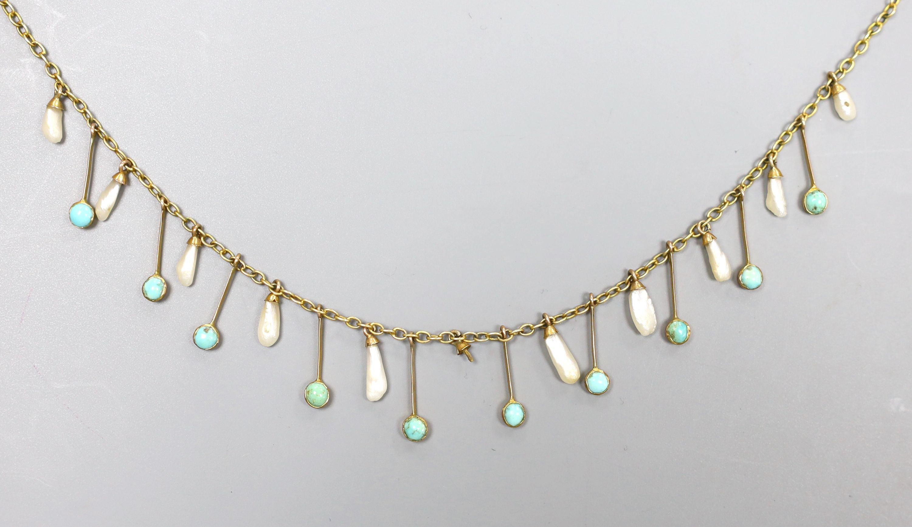 An Edwardian 9ct, baroque pearl and turquoise set drop fringe necklace, 38cm, gross 4.6 grams.